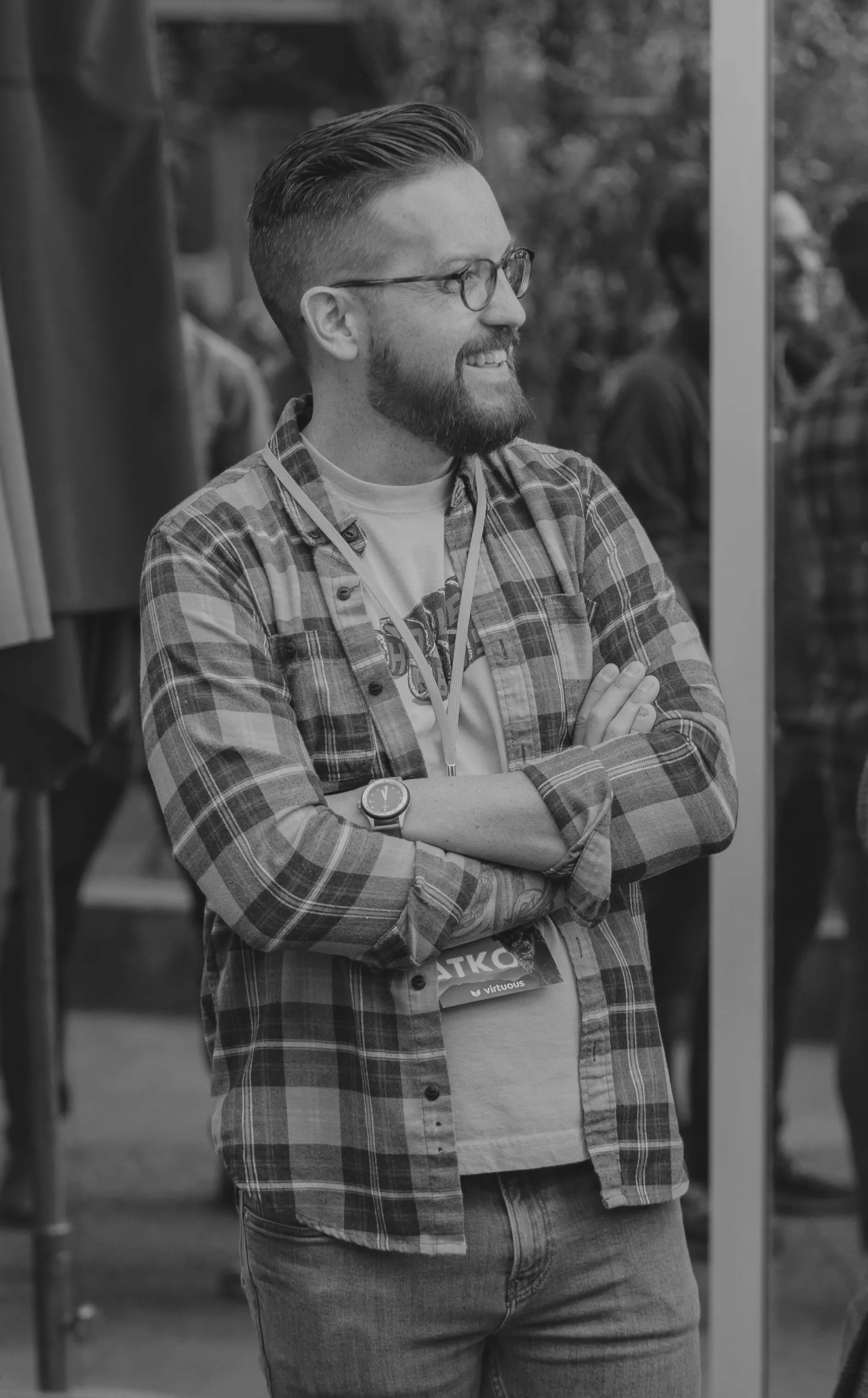 Jason VanLue, arms crossed, at a conference